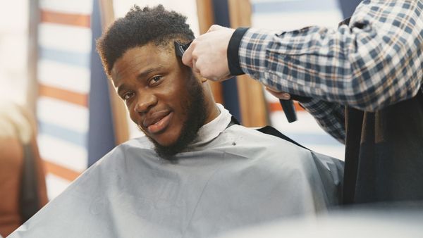 confident man getting haircut confident man getting haircut