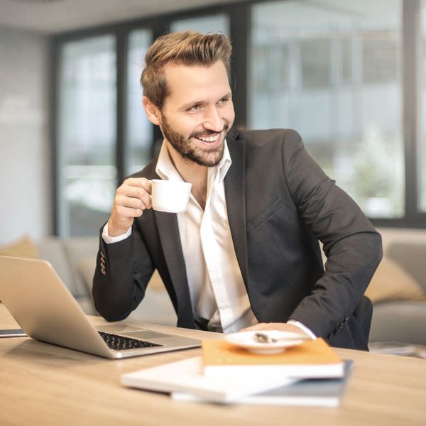well groomed man wearing suit in meeting